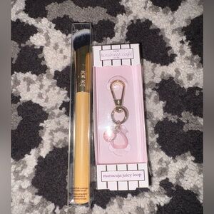 Tarte makeup brush and keychain.